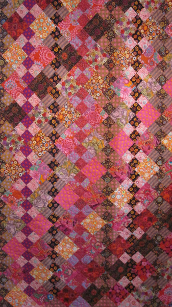 Monochrome quilt with intricate stitching